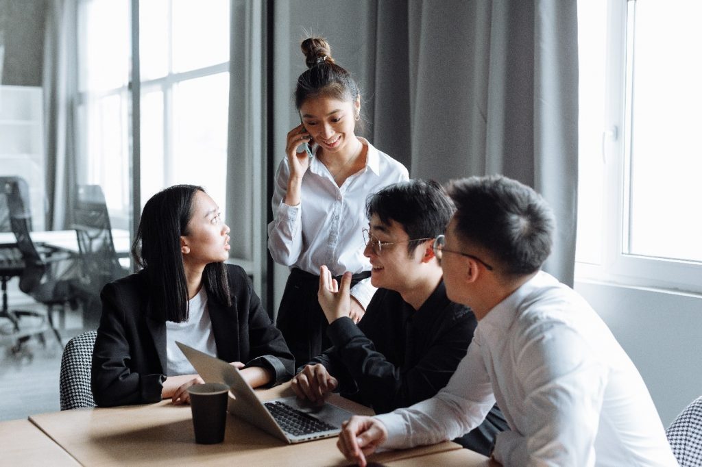 Employees discussing about Business Grants